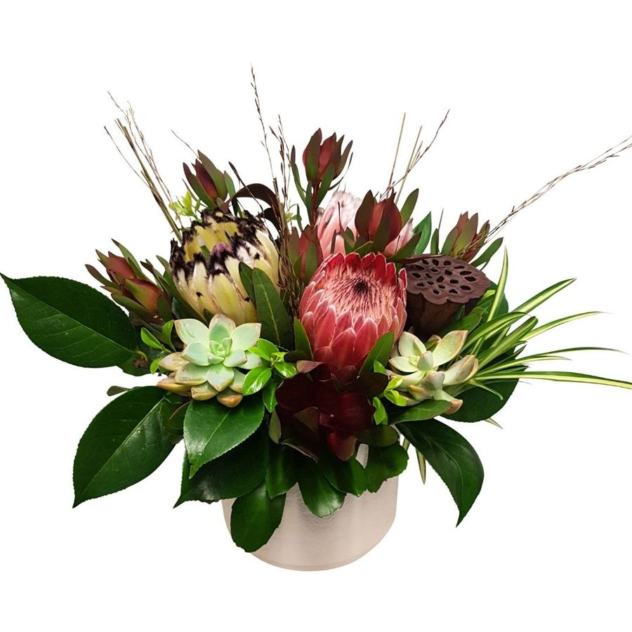 winter flowers in arrangement seasonal varities of blooms including pink proteas