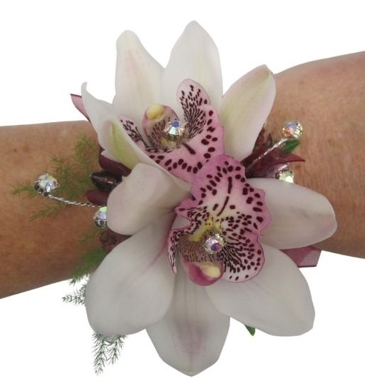 pink mini cymbidium orchid wrist corsage with diamond sprinkles