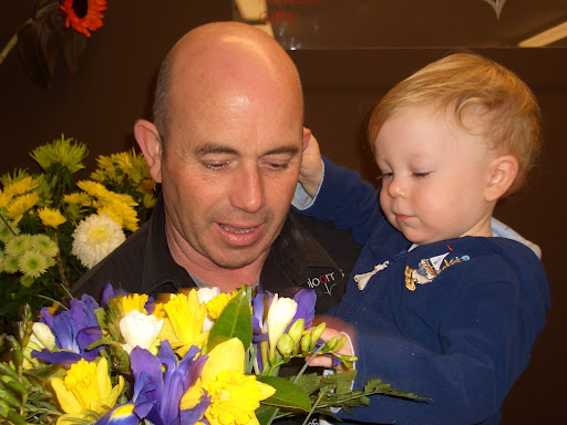 phil and baby james in the flower shop in henderson